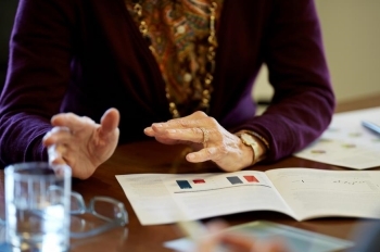 financial advisors hands at conference table